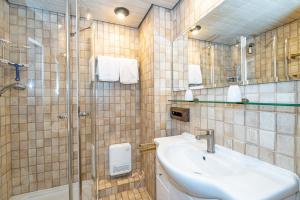 a bathroom with a sink and a shower at Wattblick in Braderup +17 photos
