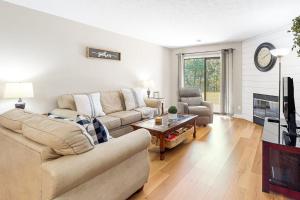 a living room with two couches and a fireplace at Overlook Retreat, Apt. 3 in Branson +18 photos