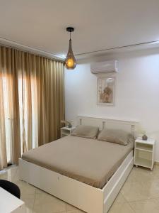 a bedroom with a large bed in a room at Luxe appartement Berkane in Berkane +44 photos