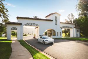 a white car parked in front of a house at Omni La Costa Resort & Spa Carlsbad in Carlsbad