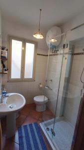 a bathroom with a shower and a toilet and a sink at Villetta Marausa - Birgi KITE in Marausa +16 photos