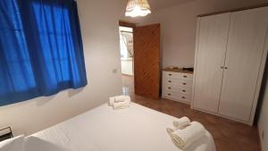 a bedroom with a bed with two towels on it at Villetta Marausa - Birgi KITE in Marausa