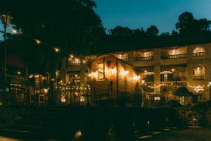 a building lit up at night with lights at Hacienda Santa Maria Regla in Huasca de Ocampo