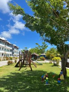 a group of children playing in a park at Refúgio Cachoeira Guaibim in Guaibim