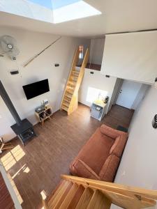 an overhead view of a living room with a couch and a tv at Casa Guilligan By Los Naufragos in El Bateque