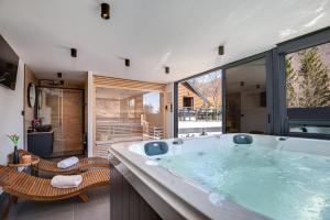 a large bathroom with a large soaking tub at Villa Dodo in Soboli