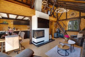 a living room with a television and a dining room at Villa Dodo in Soboli