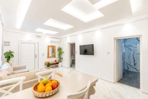 a living room with a table and a couch at Meraki Home in Lixouri