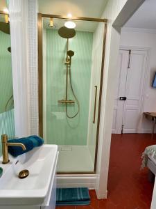 a bathroom with a shower and a white sink at Casa-Belle in Sérignan +22 photos