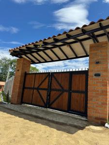 a wooden garage door with awning on a house at Villa Alma in Medellín