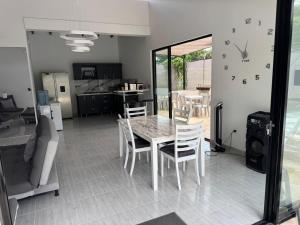 a dining room with a table and chairs at Villa Alma in Medellín
