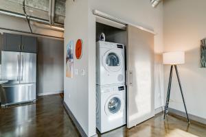 a laundry room with a washer and dryer in it at Sable 901 - Penthouse in Minneapolis