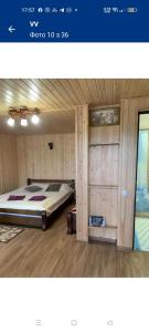 a bedroom with a large bed in a room at ViV in Vorokhta