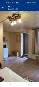 an empty room with a kitchen and a living room at ViV in Vorokhta