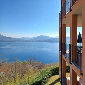 a view from the balcony of a house overlooking a lake at Residence Il Vigneto in Oggebbio