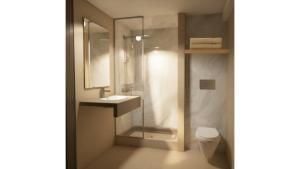 a bathroom with a shower and a sink and a toilet at Kyriad - L'Isle D'Abeau Bourgoin Jallieu in LʼIsle-dʼAbeau +16 photos