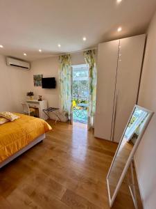 a bedroom with a bed and a dresser and a mirror at Villa Ice Sorrento in Sorrento +118 photos