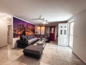 a living room with a couch and a table at Comfort Stay in Preveza