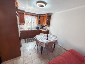 a kitchen with a table and chairs in a room at Comfort Stay in Preveza +26 photos