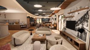 a living room with a tv and a couch and chairs at Kyriad - L'Isle D'Abeau Bourgoin Jallieu in LʼIsle-dʼAbeau