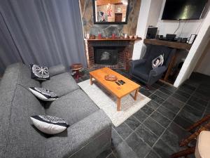 a living room with a couch and a coffee table at Valhalla in Champagne Valley