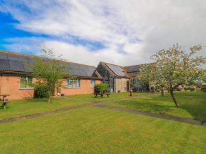 a group of houses with a grass yard at Carthouse in Weston-super-Mare