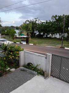 a view of a road from a balcony at Desirella Villa studio in Mahébourg +6 photos