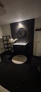 a bathroom with a sink and a bath tub at de bron in Beringen +33 photos