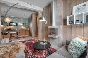 a living room with a couch and a table at Håkøya Lodge in Tromsø +40 photos