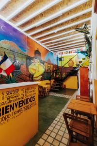 a room with a mural of a train on the wall at Hostal Guadalajara in Guadalajara