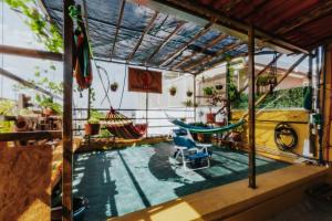 a room with a pool and two hammocks at Hostal Guadalajara in Guadalajara
