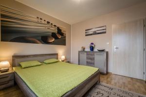 Postel nebo postele na pokoji v ubytování Apartman Elegance + 26 fotografií