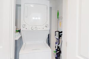 a white washer and dryer in a room at Seas the Day OBX in Kitty Hawk Beach