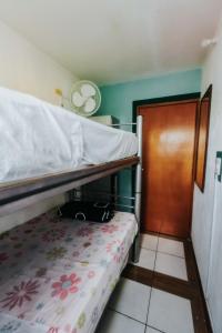 a small room with two bunk beds and a door at Hostal Guadalajara in Guadalajara