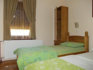 a bedroom with two beds and a window at Kuća za odmor "Karalic" in Ležimir +96 photos