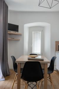 a table and chairs in a kitchen with a window at Regina e Oriente in Baveno +84 photos
