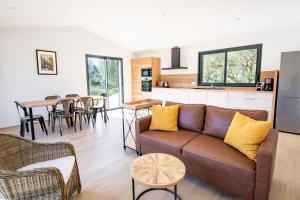 a living room with a couch and a table at Villa Ena in Figari