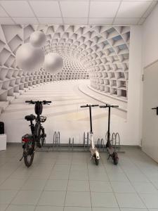 two bikes parked in a room with a tunnel at Apartment mit Gartenblick und Terrasse in Baden