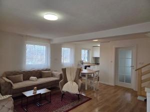 a living room with a couch and a table at Danka Riverside House in Livno