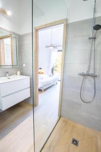 a bathroom with a shower and a sink at Villa Ena in Figari +17 photos