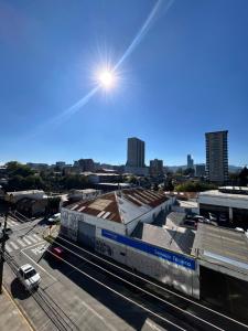 a train station with the sun in the sky at Edificio león Gallo in Temuco