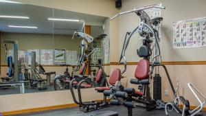 a gym with several exercise bikes in front of a mirror at Cahilty #211 home in Sun Peaks +2 photos