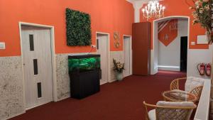 a hallway with a fish tank in a room at Penzion Ruprechtice in Mezimesti
