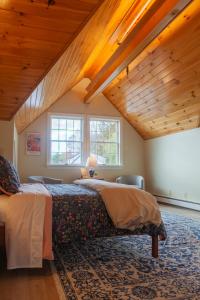a bedroom with a bed and a wooden ceiling at The Manor Bed and Breakfast in Newcastle