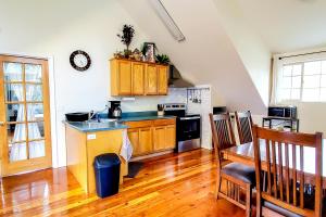 a kitchen with a sink and a stove top oven at Explore Caves & Coast! Family-Friendly Oregon Stay in Cave Junction +13 photos