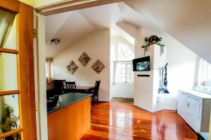 a kitchen with a counter and a refrigerator in a room at Explore Caves & Coast! Family-Friendly Oregon Stay in Cave Junction