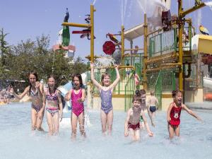 a group of children playing in the water at a water park at Bungalow in Breskens near Beach & Lighthouse in Breskens