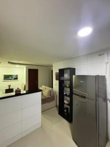 a kitchen with a stainless steel refrigerator in a kitchen at Do mar ao Lar in Rio de Janeiro +7 photos