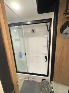 a glass door of a refrigerator in a room at Bumblebee - Luxury Destination Trailer in Canyon Lake +12 photos