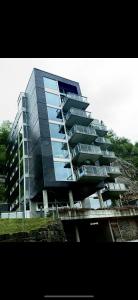 a tall building with balconies on the side of it at Bergen Apartment with a view in Bergen +9 photos